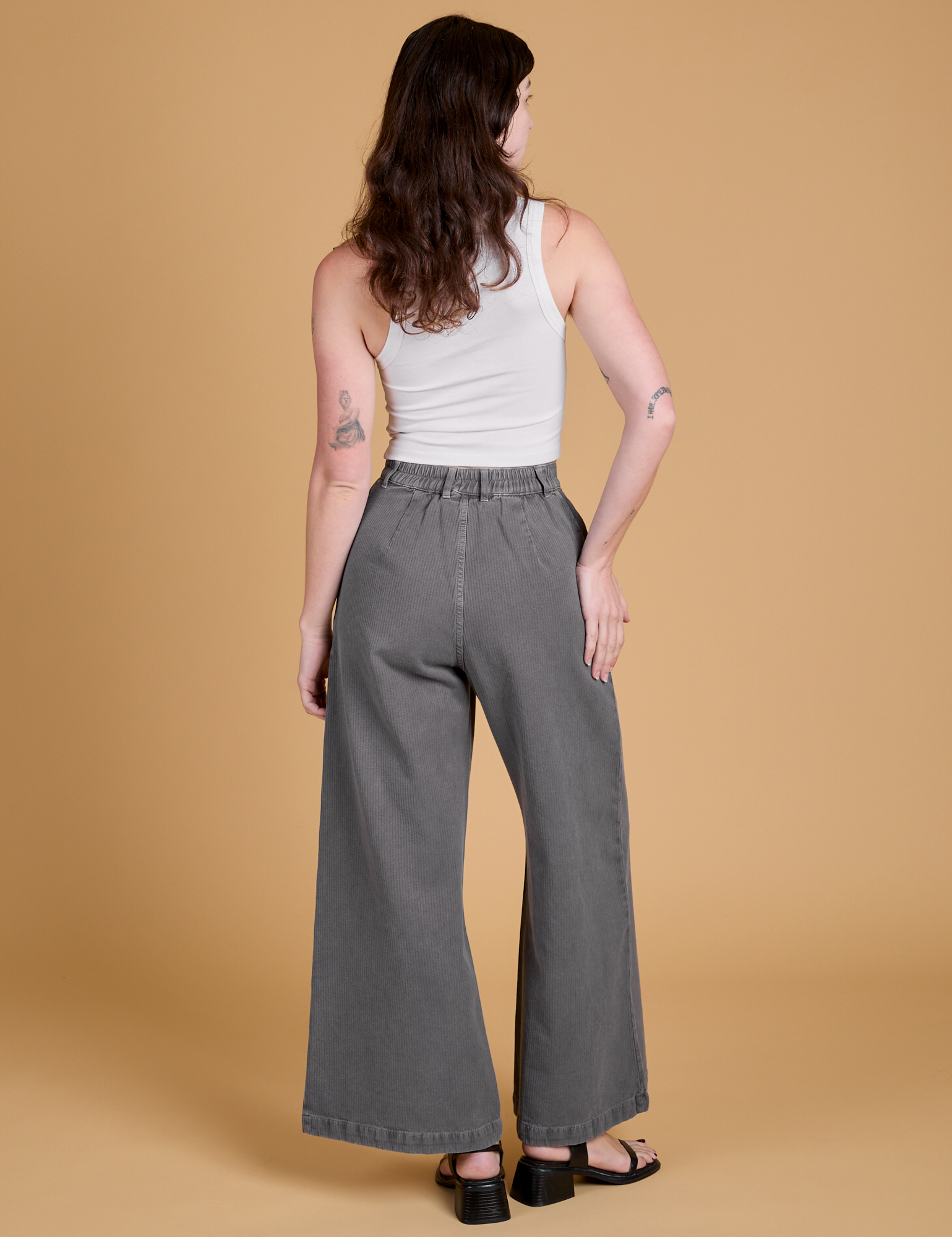Heritage Wide Leg Trousers in Washed Grey back view on Alex
