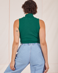 Back view of Sleeveless Essential Turtleneck in Hunter Green and light wash Trouser Jeans on Tiara