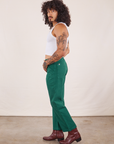 Side view of Work Pants in Hunter Green worn by Jesse