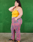Side view of Work Pants in Electric Leopard and sunshine yellow Cami on Ashley