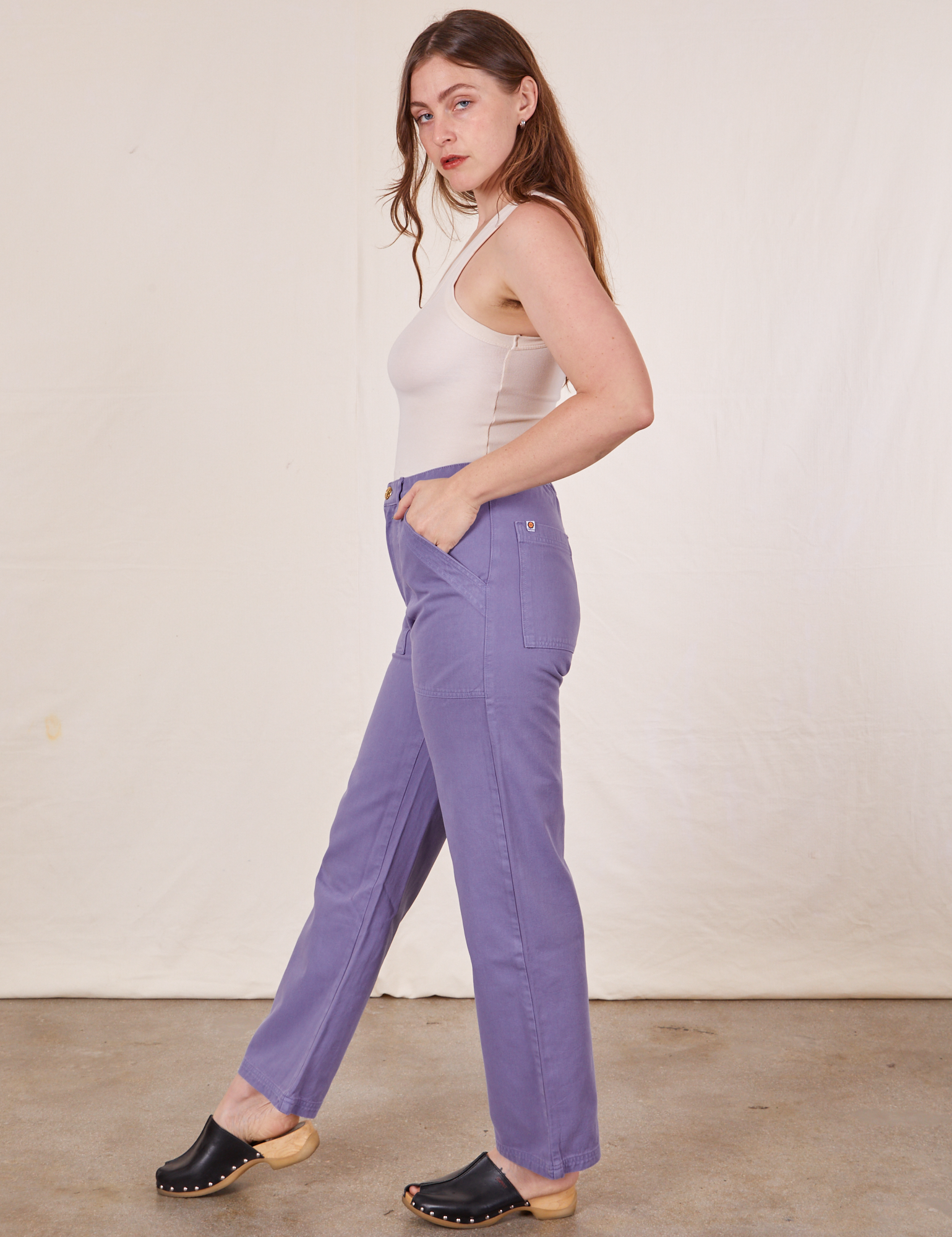 Work Pants in Faded Grape side view on Allison wearing vintage off-white Tank Top