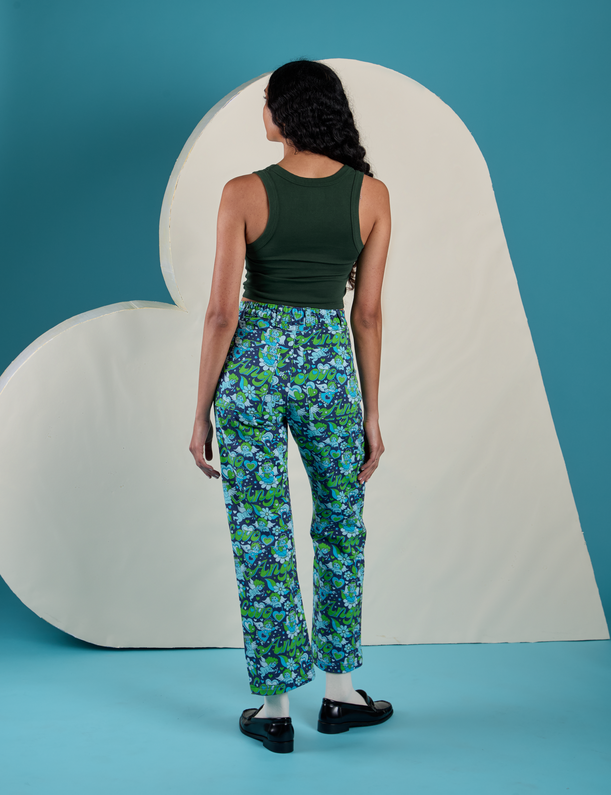 Back view of Work Pants in Angel Print and swamp green Cropped Tank on Shahana