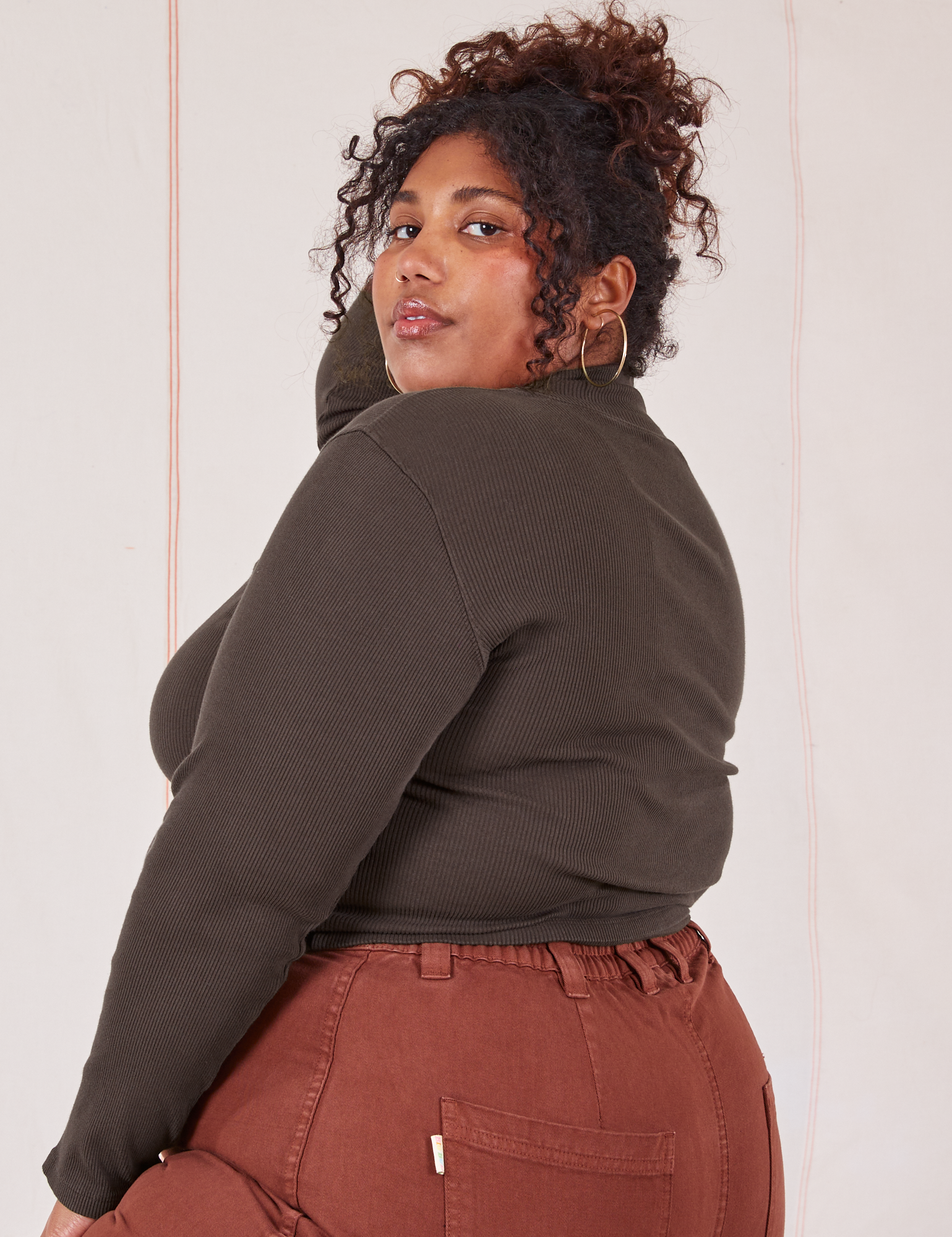 Angled back view on Essential Turtleneck in Espresso Brown on Morgan
