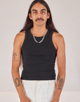 Anthony is 5’10” and wearing S Racerback Tank in Basic Black