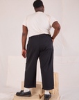 Back view of Mid-Rise Pleated Trousers in Basic Black and Organic Vintage Tee in vintage tee off-white