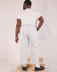 Back view of Mid-Rise Pleated Trousers in Stone White and Organic Vintage Tee in vintage tee off-white