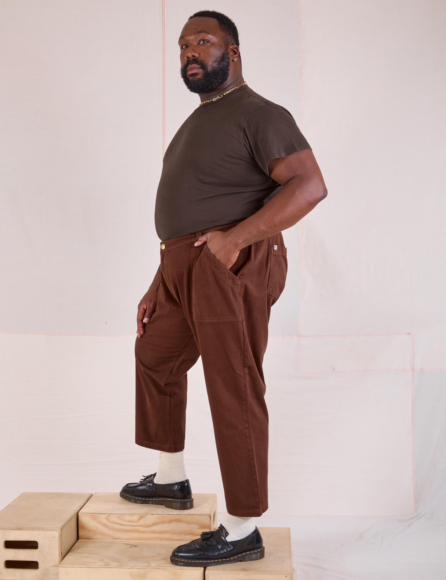 Side view of Mid-Rise Work Pants in Fudgesicle Brown and espresso brown Organic Vintage Tee on Elijah