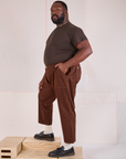 Side view of Mid-Rise Work Pants in Fudgesicle Brown and espresso brown Organic Vintage Tee on Elijah