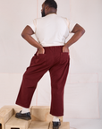 Back view of Mid-Rise Work Pants in Red Wine and Organic Vintage Tee in vintage tee off-white on Elijah