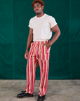 Angled front view of Stripe Work Pants in Cherry Candy and Organic Vintage Tee in vintage tee off-white on Issac