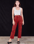 Alex is 5'8" and wearing XS Black Stripe Work Pants in Mustang Red paired with a Cropped Tank in vintage tee off-white