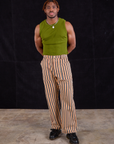 Issac is 5'10" and wearing M Work Pants in Autumn Stripe paired with summer olive Muscle Tee