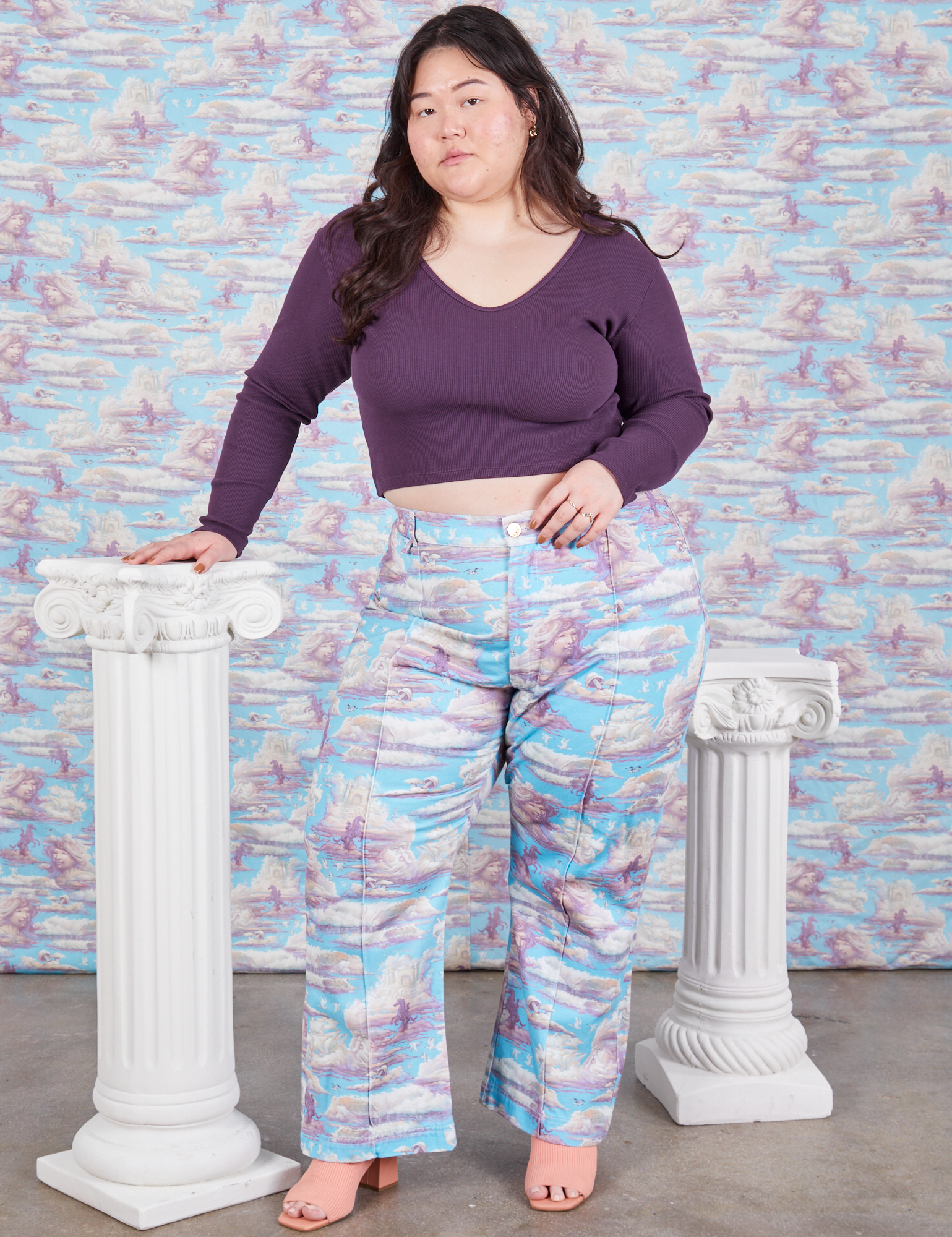 Ashley is 5&#39;7&quot; and wearing 1XL Western Pants in Cloud Kingdom paired with nebula Long Sleeve V-Neck Tee
