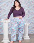 Ashley is 5'7" and wearing 1XL Western Pants in Cloud Kingdom paired with nebula Long Sleeve V-Neck Tee