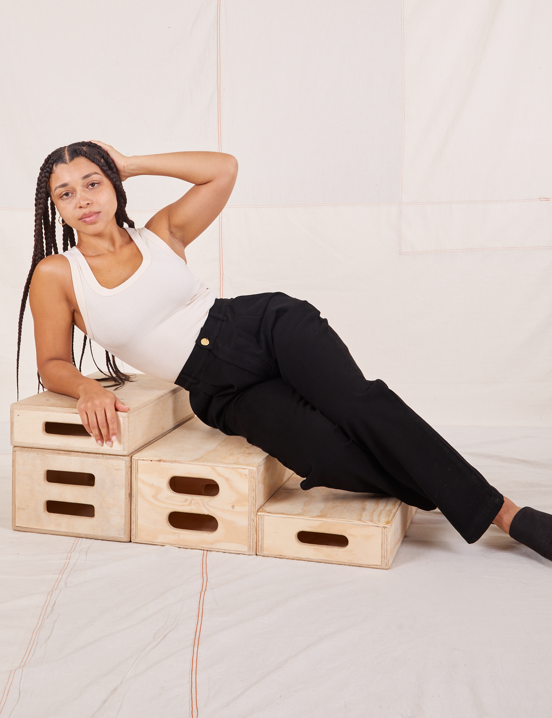 Gabi is wearing Organic Trousers in Basic Black and vintage off-white Tank Top