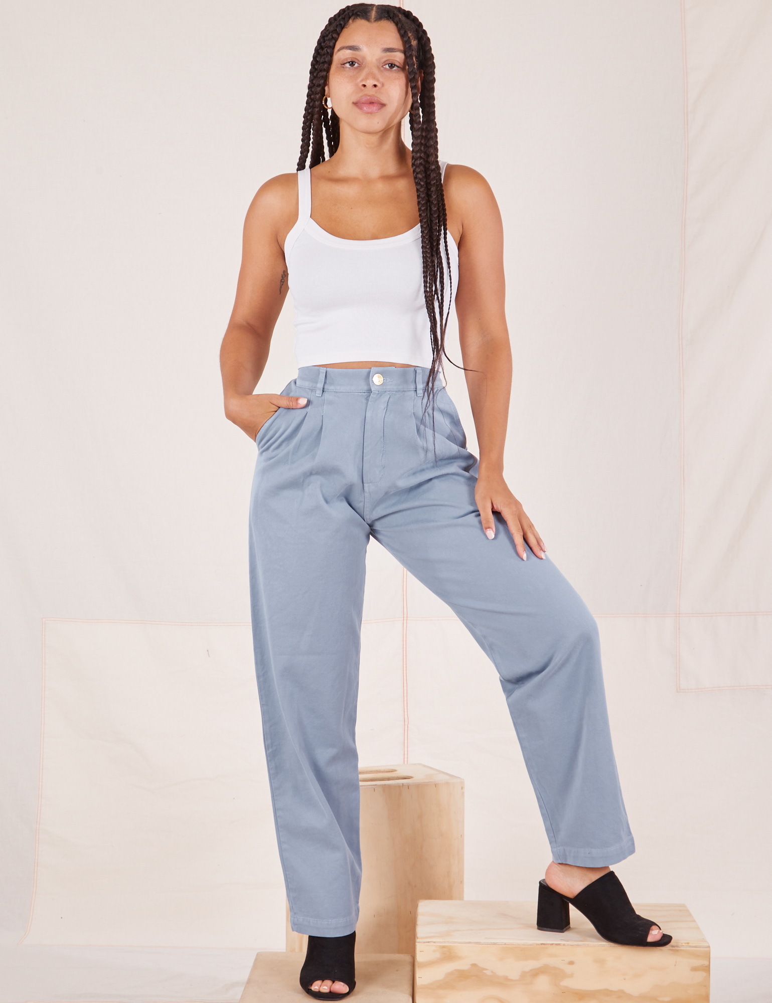 Gabi is 5&#39;7&quot; and wearing XXS Organic Trousers in Periwinkle paired with vintage off-white Cropped Cami