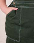 Original Overalls in Swamp Green front pocket close up on Marielena