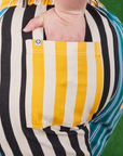 Mismatched Stripe Work Pants back pocket close up. Ashley has her hand in the pocket.