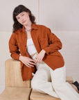 Alex is wearing Twill Overshirt in Burnt Terracotta