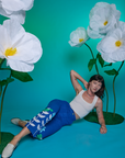 Alex is wearing Paintstamped Work Pants in Daisy and Cropped Tank in Vintage Tee White