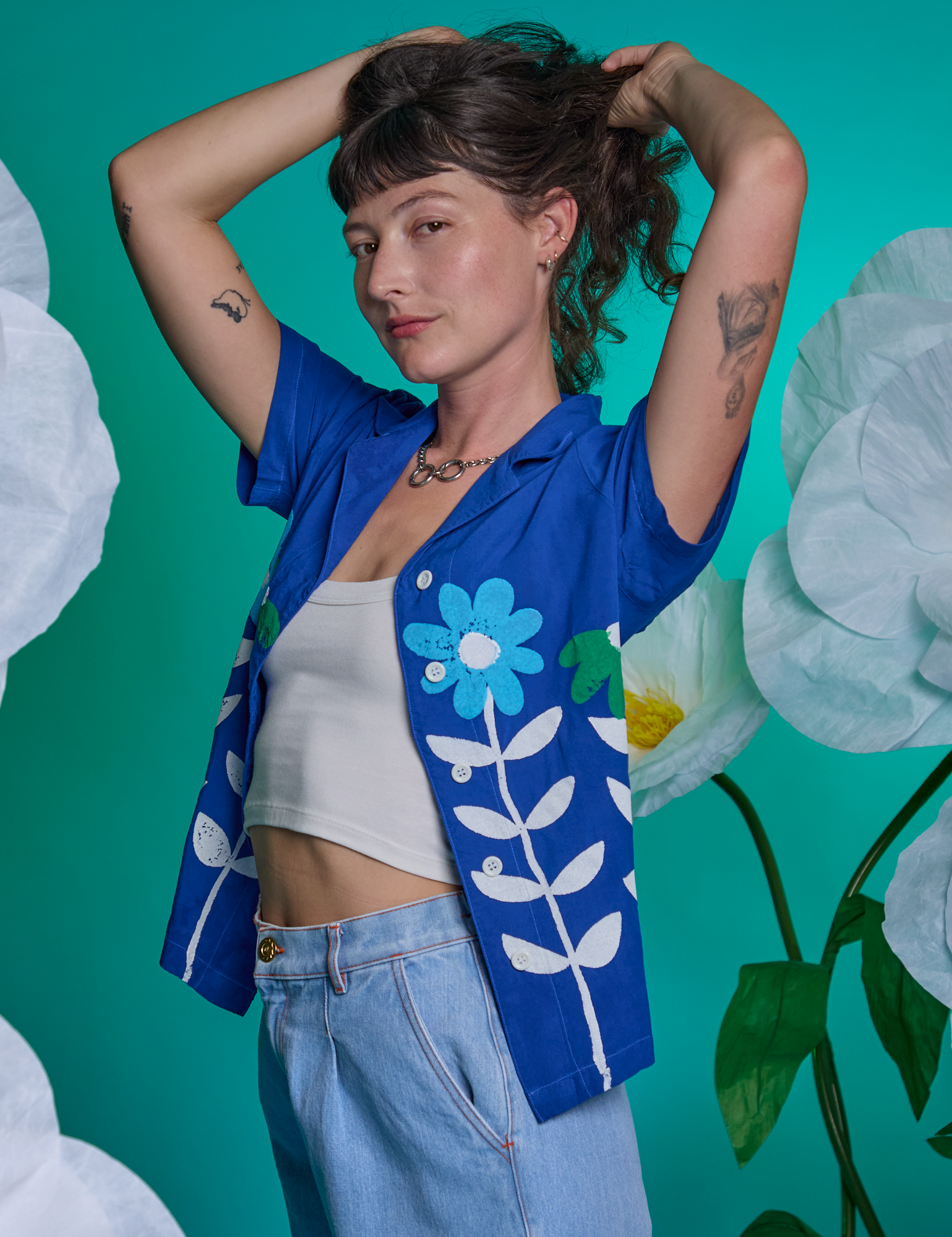 Alex is wearing Paintstamped Pantry Button-Up in Daisy