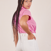 Angled back view of Pantry Button-Up in Bubblegum Pink worn by Gabi