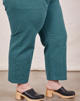 Pant leg close up side view of Petite Short Sleeve Jumpsuit in Marine Blue worn by Ashley