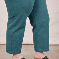 Pant leg close up side view of Petite Short Sleeve Jumpsuit in Marine Blue worn by Ashley