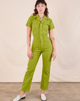 Alex is 5'8" and wearing XXS Short Sleeve Jumpsuit in Gross Green