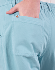 Close up of Quinn's hand in the back pocket of Work Pants in Baby Blue