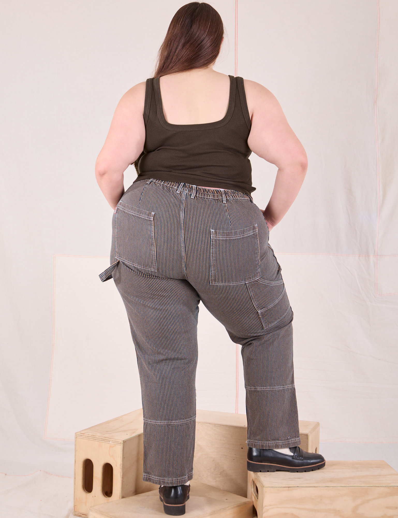 Back view of Railroad Carpenter Jeans in Vintage Tan and espresso brown Square Neck Tank on Marielena