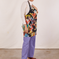 Side view of Artist Togs Full Apron in Rainbow Magic Waters worn by Tiara