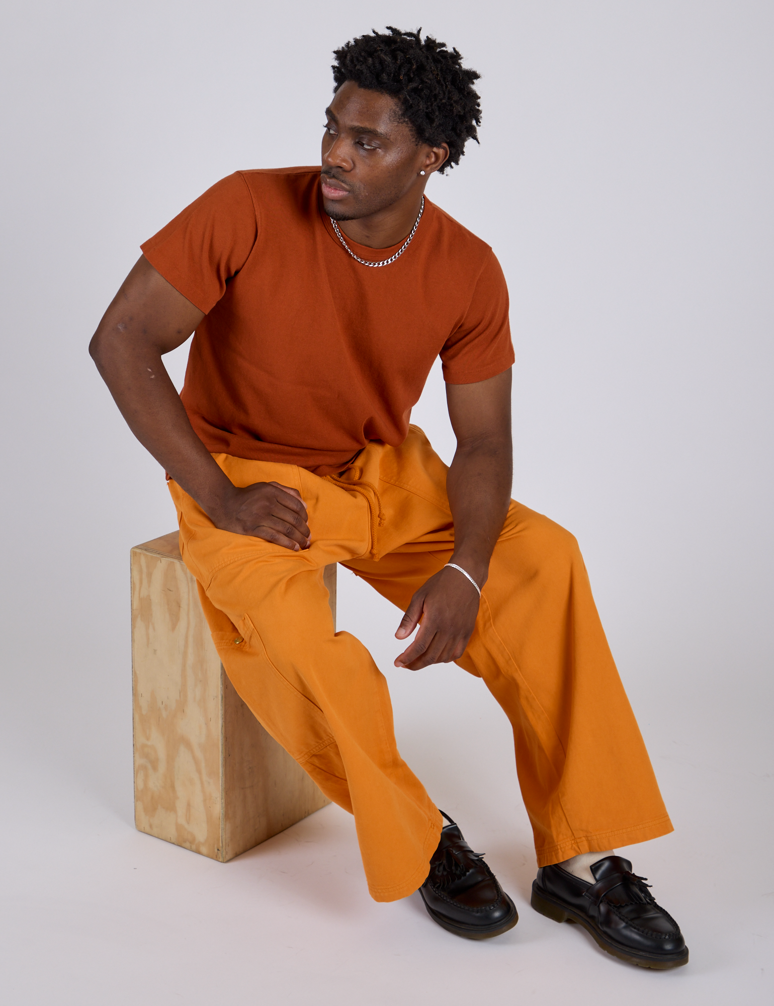 Drop Pocket Cargo Pants in Creamsicle Orange and burnt terracotta Organic Vintage Tee on Isaac