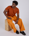 Drop Pocket Cargo Pants in Creamsicle Orange and burnt terracotta Organic Vintage Tee on Isaac