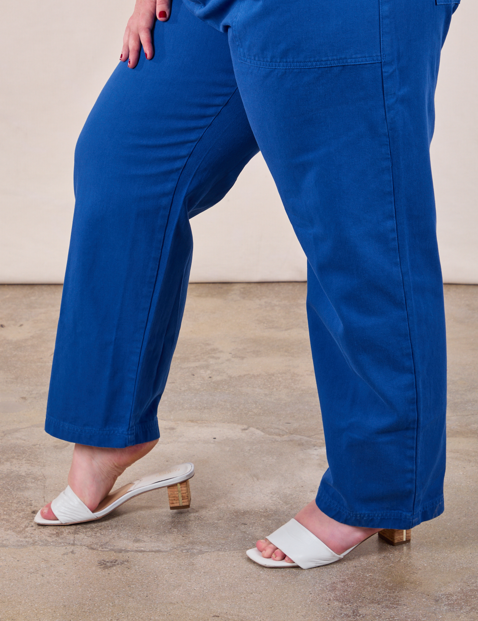 Short Sleeve Jumpsuit in Royal Blue pant leg close up on Juliet