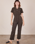 Alex is 5'8" and wearing XS Short Sleeve Jumpsuit in Espresso Brown