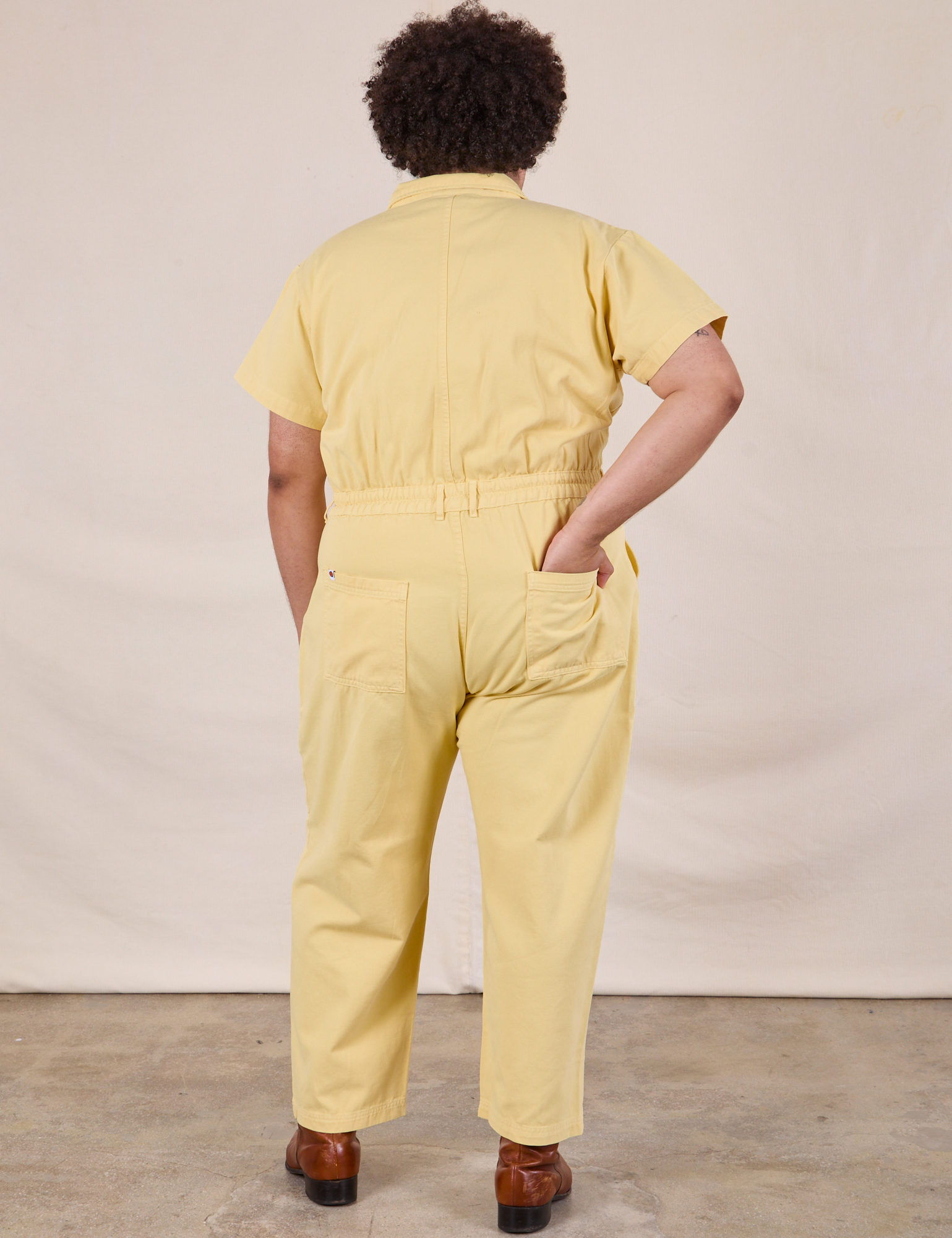 Short Sleeve Jumpsuit in Butter Yellow back view on Miguel