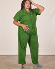 Angled view of Short Sleeve Jumpsuit in Lawn Green worn by Alicia