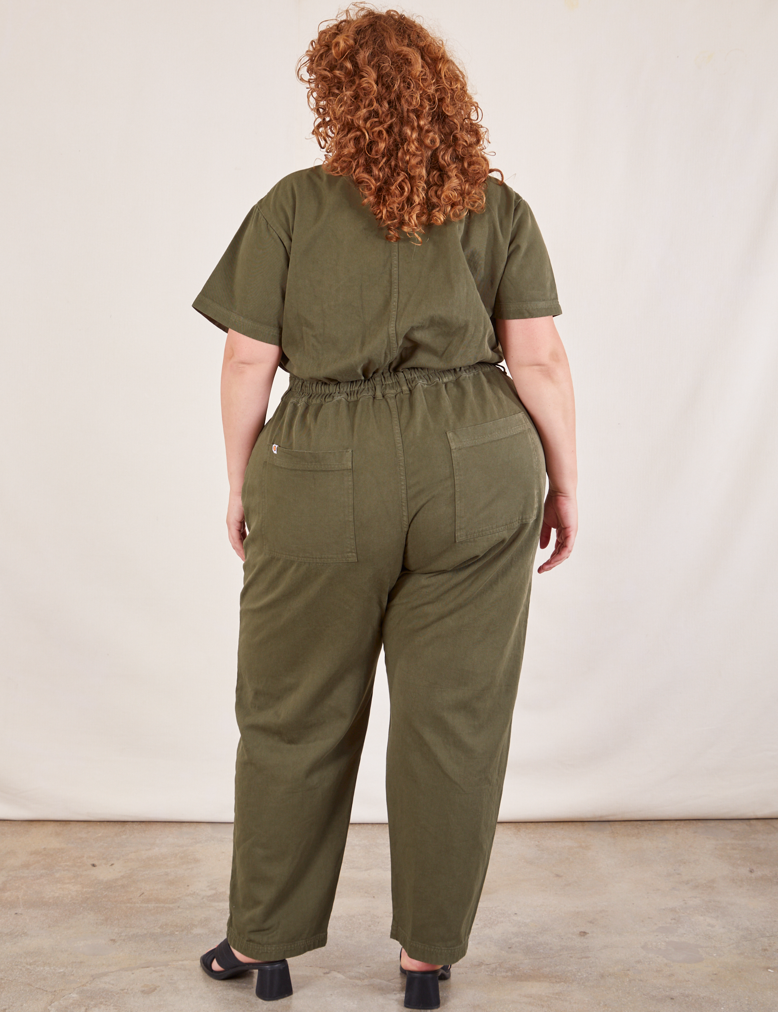 Short Sleeve Jumpsuit in Surplus Green back view on Bree