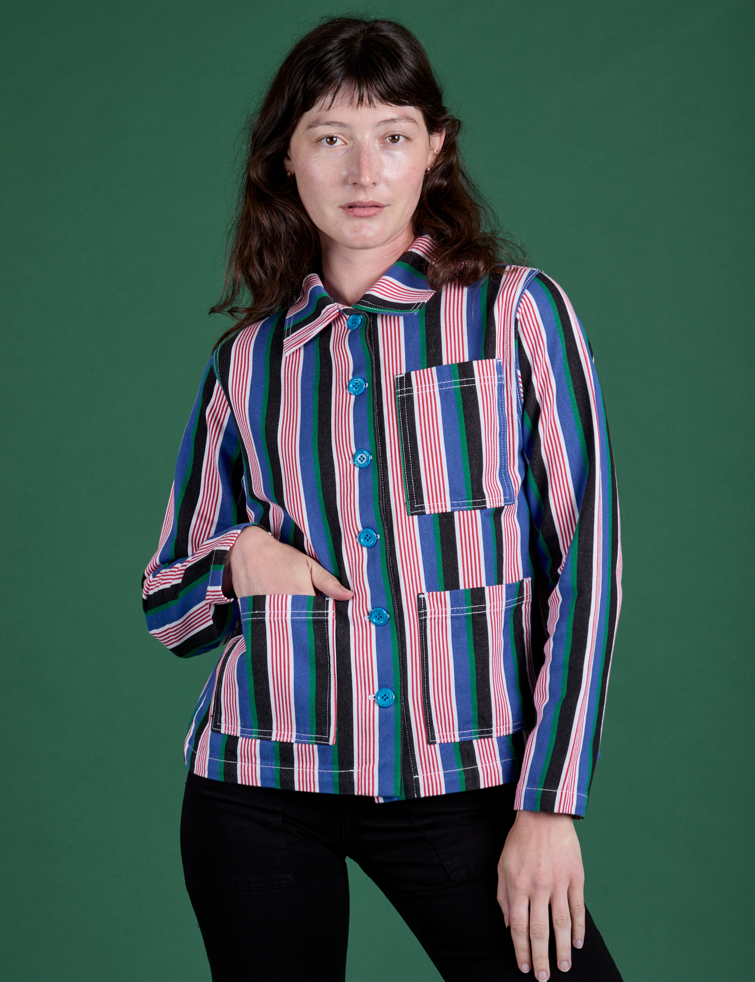 Alex is wearing a buttoned up Stripe Work Jacket in Pacific Stripe