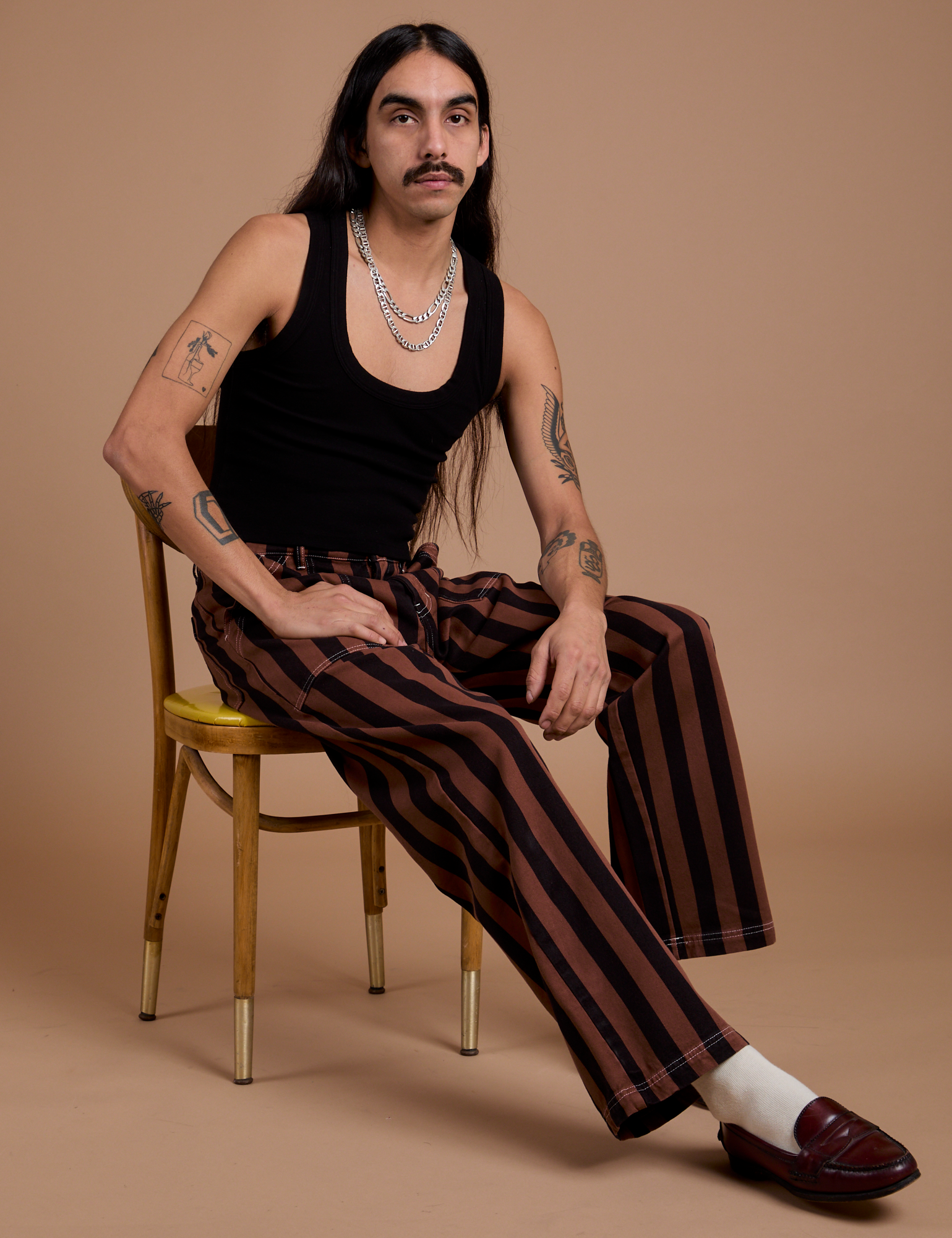 Black Stripe Work Pants in Fudgesicle Brown and black Cropped Tank worn by Anthony