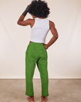 Back view of Cropped Rolled Cuff Sweatpants in Lawn Green and vintage off-white Cropped Tank Top on Jerrod