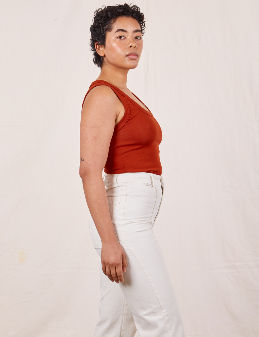 Tank Top in Paprika side view on Mika wearing vintage off-white Western Pants