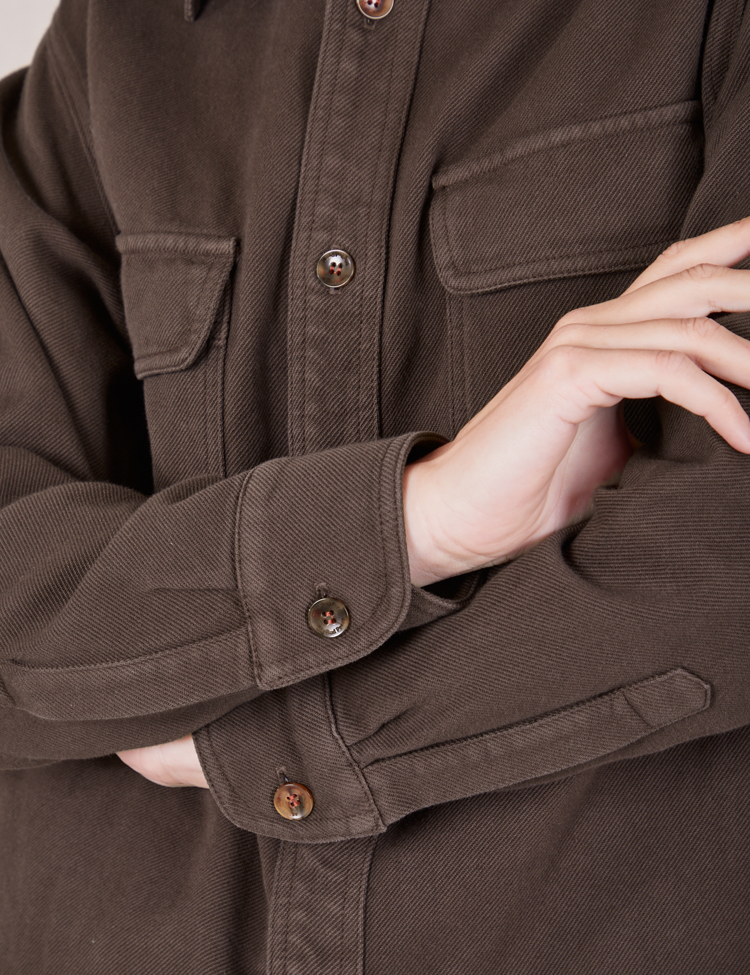 Front sleeve close up of Flannel Overshirt in Espresso Brown on Alex
