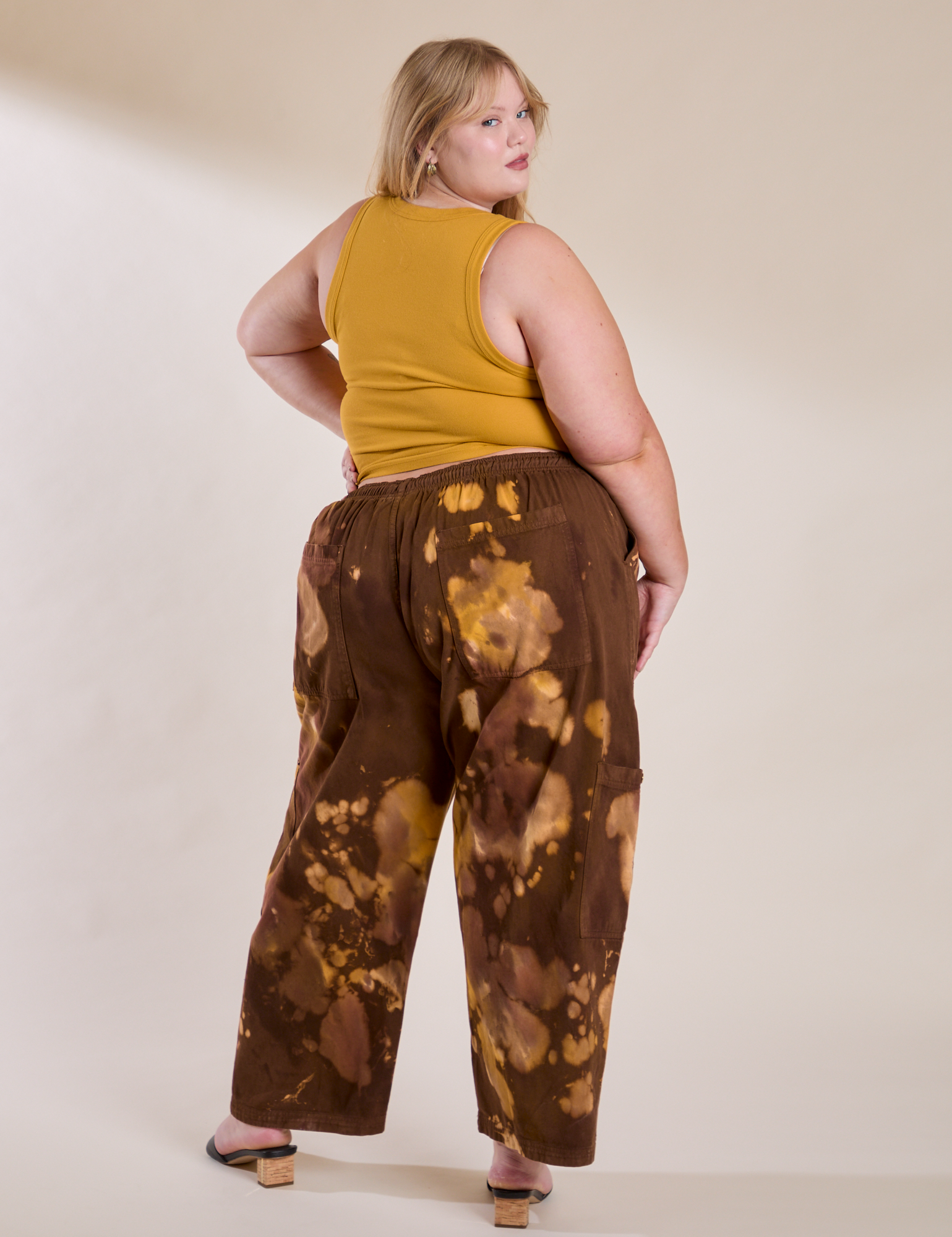 Back view of Magic Waters Drop Pocket Pants in Honey Brown and mustard yellow Cropped Tank on Juliet