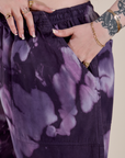 Close up of Sydney's hand in the front pocket of Magic Waters Drop Pocket Pants in Dark Lavender