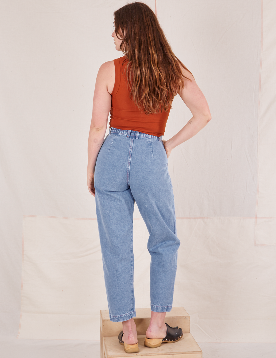 Back view of Denim Trouser Jeans in Light Wash and burnt orange Tank Top worn by Allison