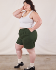 Side view of Trouser Shorts in Swamp Green and Cropped Tank in Vintage Tee Off-White on Ashley