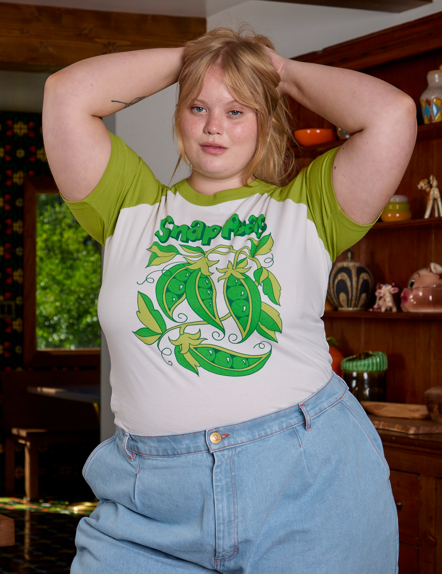 Juliet is wearing Short Sleeve Raglan Tee in Snap Peas