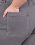 Close up of Marielena's hand in the back pocket of Work Pants in Washed Grey